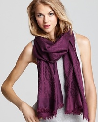 Decorated by a jacquard pattern of iconic Ts, this beautiful Tory Burch scarf channels stay-warm style.