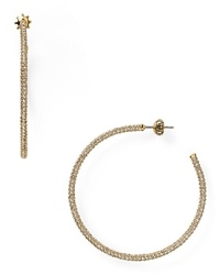 This pair of Juicy Couture hoops is a jewel box staple, simply styled in gold plate with a rim of subtle, sparkling stones.