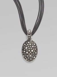 From the Starlight Collection. Granules of sparkling diamonds, resembling a starry night sky, are sprinkled on a black rhodium oval enhancer. Diamonds, 0.76 tcw Black rhodium and sterling silver Length, about 1½ Width, about ¾ ImportedPlease note: Chain sold separately. 