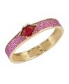 Pucker up. This bangle bracelet from Betsey Johnson is crafted from antique gold-tone mixed metal with fuchsia glass crystal accents, sealing everything with a kiss. Approximate diameter: 2-1/4 inches.