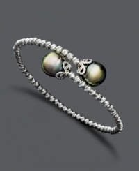 Wrap your wrists with the perfect finishing touch. Elegant bracelet features a unique, wrapped cuff design with cultured Tahitian pearl (9-10 mm) ends and sparkle bead accents. Crafted in sterling silver. Approximate length: 7-1/2 inches.