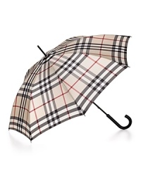 Stay high (fashion) and dry: top off your look with this forever-stylish Burberry umbrella.