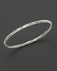 From the Silver collection, a skinny hammered bangle in sterling silver. Designed by Ippolita.