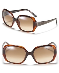 Oversized rectangle frame sunglasses with signature logo print at sides for chic style.