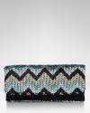 Effervescent metallic beads in a zig-zag pattern shine on this polished MOYNA clutch, while its slim, flap silhouette gives the striking piece a modern ease.