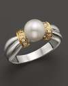 Brilliant diamonds, set in 14K. yellow gold, frame a gleaming akoya cultured pearl in a 14K. white gold band.