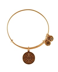 A starry symbol etched on a delicate charm hangs from this expandable Alex and Ani bangle, crafted from recycled materials.