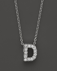 From the Tiny Treasures collection, a diamond D necklace. With signature ruby accent. Designed by Roberto Coin.