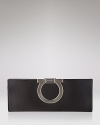 A sleek satin clutch with signature logo clip closure from Salvatore Ferragamo.