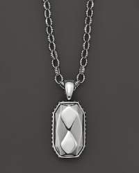 Faceted sterling silver makes a striking statement on a link chain.