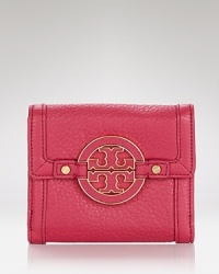 Cast in rich leather with a simple, streamlined shape, this practical piece from Tory Burch is an effortless choice for organizing the essentials.