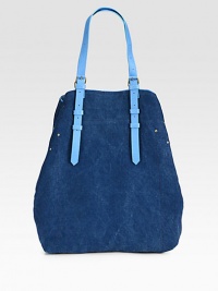 A casually chic style in denim-inspired canvas with luxurious leather trim.Adjustable shoulder straps, 2-14 dropSnap button strap closureOne inside open pocketOne detachable flashlight12W X 15H X 4DMade in Italy