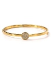 Hit the bright spot with this kate spade new york bangle, cast in gold plate with a striking crystal stone station.