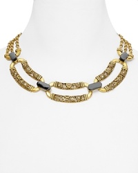 A Deco-inspired showpiece from T Tahari, this bold necklace brings instant glamor to your look, cast in plated metal with rich stone detailing.