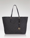 MICHAEL Michael Kors' jet-setting glamor is ready to take off with this spacious tote which is sized to carry it all, on or off the tarmac.