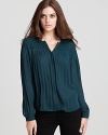 Pretty pleats add classic definition to this light-as-air Rebecca Taylor blouse.