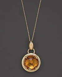 An expertly-rendered, faceted round citrine pendant set in 16 Kt. gold, with fine link chain.