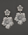 Delicate gardenias, captured at the height of their beauty in sterling silver, bloom on these earrings from Buccellati.