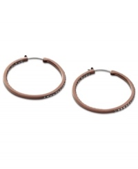 A delicious hoop design from Fossil. These earrings feature added glitz with hematite tone pave crystal accents. Crafted in brown tone mixed metal. Approximate diameter: 1-3/8 inches.