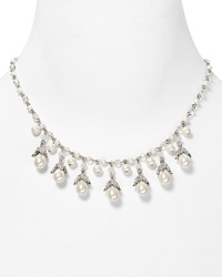 Shimmering glass pearls and crystal accents are an elegant focal point on this Lauren Ralph Lauren necklace, accented by a simple silver tone chain.