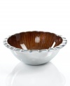 Full of surprises, this handcrafted salad bowl from the Simply Designz collection of serveware and serving dishes pairs sleek, polished aluminum with a fluted edge and beautifully lined amber enamel. With coordinating server.