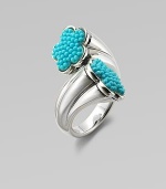 A graduated sterling silver shank with turquoise accented, flower-shaped end caps. TurquoiseSterling silverWidth, about 1Imported