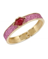 Pucker up. This bangle bracelet from Betsey Johnson is crafted from antique gold-tone mixed metal with fuchsia glass crystal accents, sealing everything with a kiss. Approximate diameter: 2-1/4 inches.