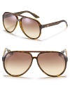 Large rounded aviator sunglasses offer a cool look with Gucci web temple treatment. Nose tabs help to secure fit.