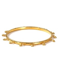 Stacked bracelets consider to be a major the trend this season. Work the look with this fringed 14-karat gold plated bangle from Melinda Maria, accented by delicate beads.