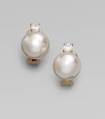 A lustrous round white pearl stud, with a sparkling cubic zirconia accent, set in 18k gold vermeil. 12mm white round organic man-made pearls Cubic zirconia 18k gold vermeil 14k gold post Post-and-hinge back Made in Spain