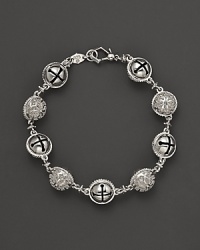 Inspired by Zen philosophy, this intricately detailed sterling silver bracelet from Paul Morelli softly jingles with meditation bells.