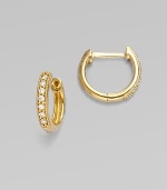 Versatile hoops of 18k yellow gold are richly set with sparkling diamonds, to wear on their own or pair with your favorite dangly charms. Diamonds, 0.11 tcw 18k yellow gold Diameter, about ½ Pierced Imported Please note: charms sold separately.