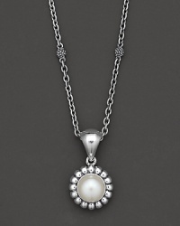 From the Luna Collection, a sterling silver fluted pendant with pearl accents on a chunky link chain. Designed by Lagos.