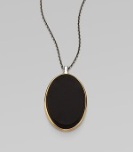 From the Saddle Collection. Sleek and dramatic, a beveled oval of matte black onyx is simply set in a frame of goldplated sterling silver, on a blackened sterling silver chain.Black onyxSterling silver and goldplated sterling silverChain length, about 16-18 (adjustable)Pendant length, about 2Lobster claspImported