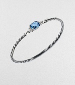 From the Petite Wheaton Collection. A faceted pillow of richly hued blue topaz, edged with diamonds and set on a classic sterling silver cable bangle.Diamonds, 0.08 tcwBlue topazSterling silverDiameter, about 2½3mm cableHook claspImported