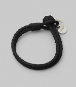 Fine leather, artfully woven into a rope design that wraps the wrist with rich character. Available in Small and Medium. Woven leather Medallion detail Small length, about 7½ Medium length, about 9 Knot and loop closure Made in Italy