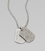 Glittering pavé: stones set in an edgy dog tag pendant on a ball chain. Cubic zirconia and glass stonesSilvertone metalLength, about 18Pendant size, about .75Toggle closure with logo charmImported 