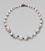 Delicate gunmetal chains hold one lustrous, white baroque shell pearl, with a Swarovski crystal-set bale and cap.Shell pearlCrystalRuthenium platedLength, about 16 with 3 extenderLobster claspMade in USA