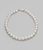 Elegant organic white man-made pearls make a perfect finishing touch. 14mm white round pearls Length, about 20 Mabé pearl and 18k gold vermeil push-lock clasp Made in Spain