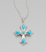 This cross of vibrant turquoise is framed in sterling silver and punctuated by luminous diamonds.Diamond, 0.15 tcw Sterling silver Pendant length, about 2½ ImportedPlease note: Chain sold separately 