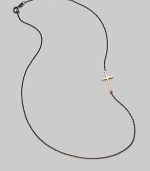 A gleaming 14K gold cross on an oxidized silver chain.14K gold Oxidized sterling silver Length, about 16 Pendant length, about ¾ Lobster clasp closure Made in USA 