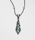 A colorful pendant encrusted with faceted multi-colored sapphires and blue topaz stones accented with bright enamel on a blue topaz station necklace on a rhodium-plated sterling silver link chain. Blue topazMulti-colored sapphiresEnamelRhodium-plated sterling silverLength, about 16Pendant size, about 2Lobster claspImported 