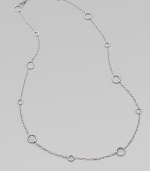 A long design punctuated with multiple sized circle links. Sterling silver Length, about 36 Lobster clasp closure Imported 