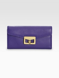 EXCLUSIVELY AT SAKS in Royal Purple. Rich pebble-grain leather in a flap-front silhouette, finished with signature logo-stamped hardware.Turnlock flap closureOne inner zip compartmentThree inside open pocketsSix inside card slotsFully lined7½W X 3½H X 1/2DImportedBoxed for giving