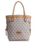 The scandal would be to leave it home! With GUESS's signature quatrefois G monogram print, side drawstrings and a tall, elegant size that's the right size for shopping, this chic carryall will be your go-to bag.