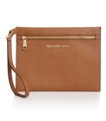 Store your stash in style with this little lovely from MICHAEL Michael Kors. Dressed in soft Saffiano leather with signature detailing, it keeps cash, cards, and other out-on-the-town essentials easily at hand.