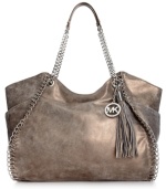 Elegance with an edge, this titillating tote from MICHAEL Michael Kors is all about attitude. Crafted from sumptuous leather with whipstitch and chain detail and signature hardware, this diva-licious design also features a roomy interior with plenty of pockets for the day-to-night essentials.