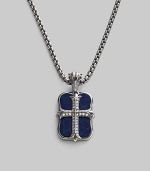 An original design pairs two sterling silver pendants on a single strand. The cross pendant is crafted with pavé diamond detail, and the larger features smooth lapis inlay. Sterling silver Pavé diamonds Lapis Pendant: 1 long Necklace: 24 long Lobster clasp closure Imported 