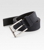 A brilliant, logo embossed silver buckle fastens this wardrobe essential of soft suede.SuedeAbout 1 wideImported