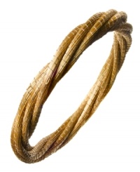 Through the use of indigenous fiber materials like buri and organic golden grass, found only in Brasil, Art da Terra creates handcrafted costume and fashion jewelry and handbags. The technique of intertwining golden grass, natural fibers and textiles into intricate designs by hand adds distinctive character to Art da Terra's creations. Own a piece of Brasil with this twisted multi-strand bangle bracelet made from golden straw found in the Amazon. Discover Brasil. The bold colors. The exotic scents. The sensual textures. The natural sensations. Only at Macy's.